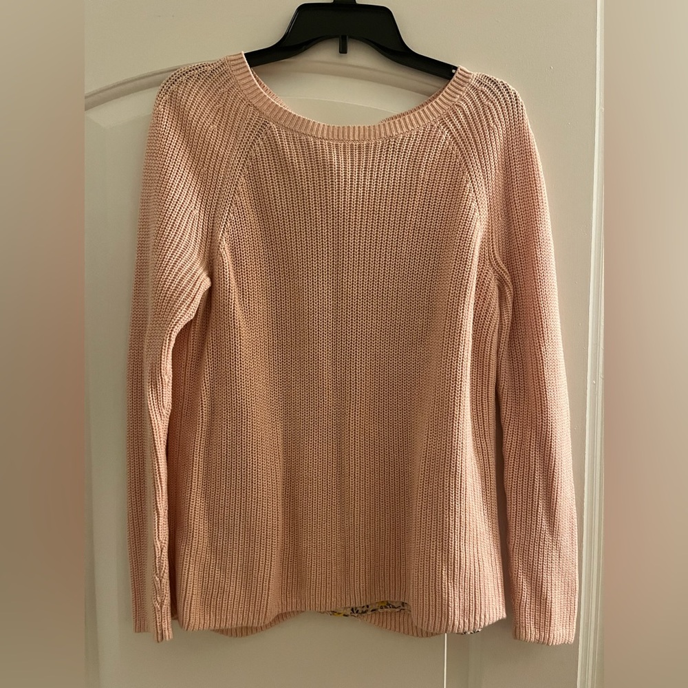 Pink sweater with floral detail on the back